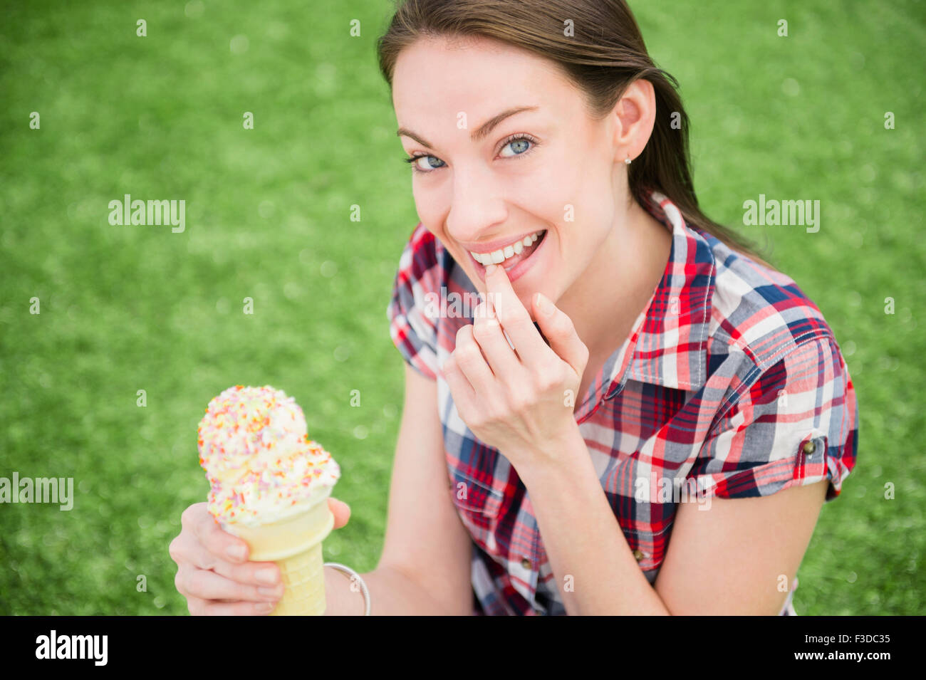 Portrait of woman eating ice cream cone Stock Photo Alamy