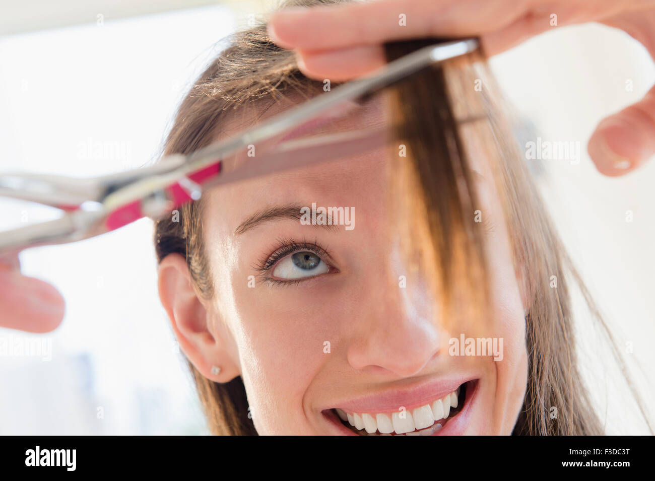 Woman Cutting Her Hair Stock Photo Alamy Woman Cutting Her Hair Stock Photo Alamy