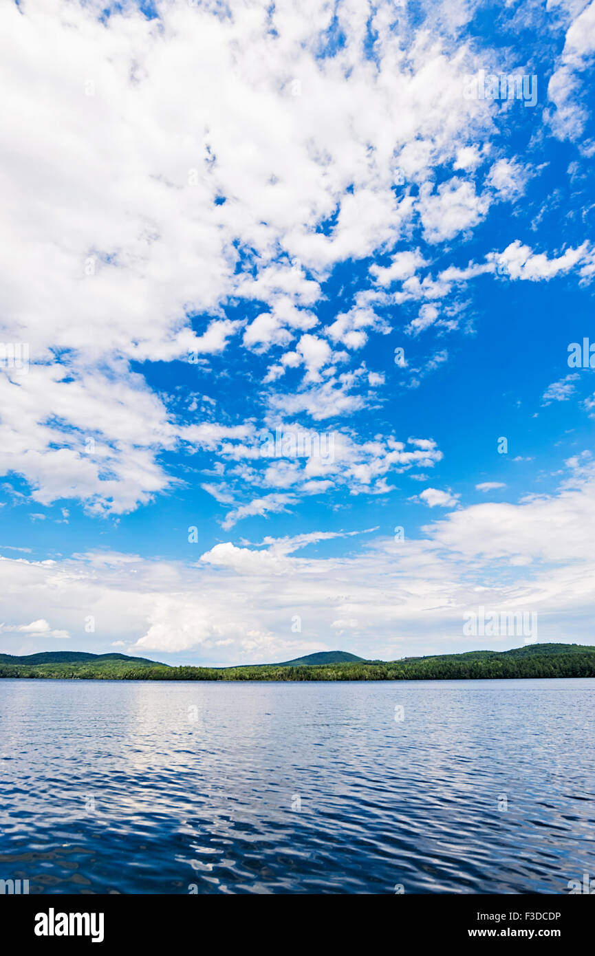 Lake under blue sky with clouds Stock Photo - Alamy