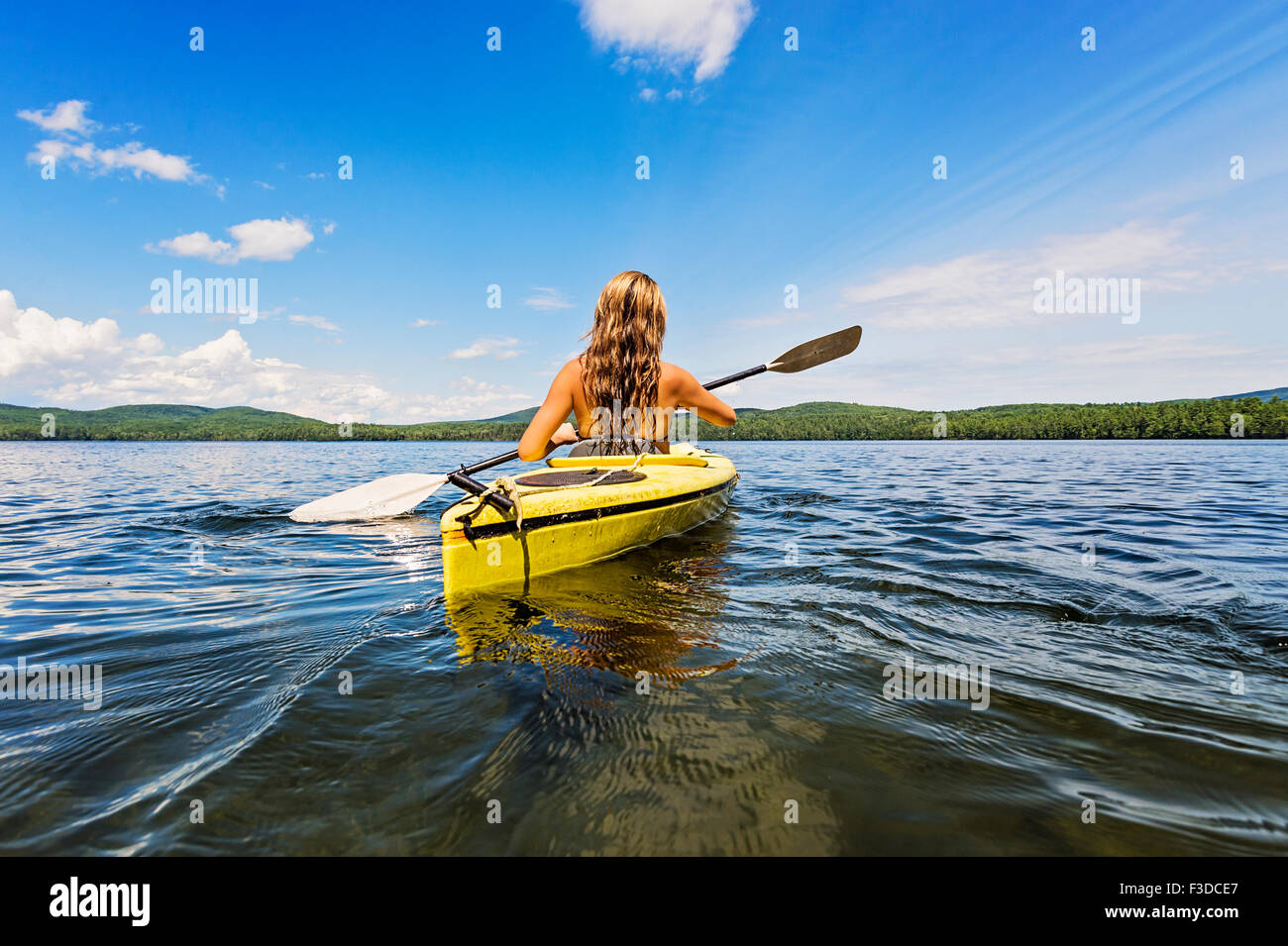 Young woman kayaking on lake Stock Photo Alamy