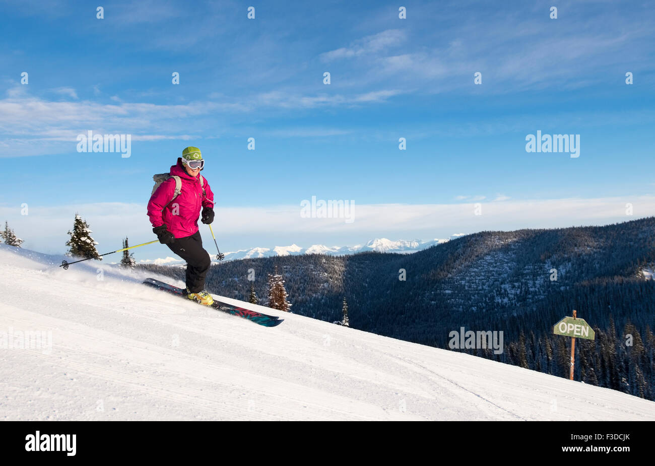 Woman skiing downhill Stock Photo