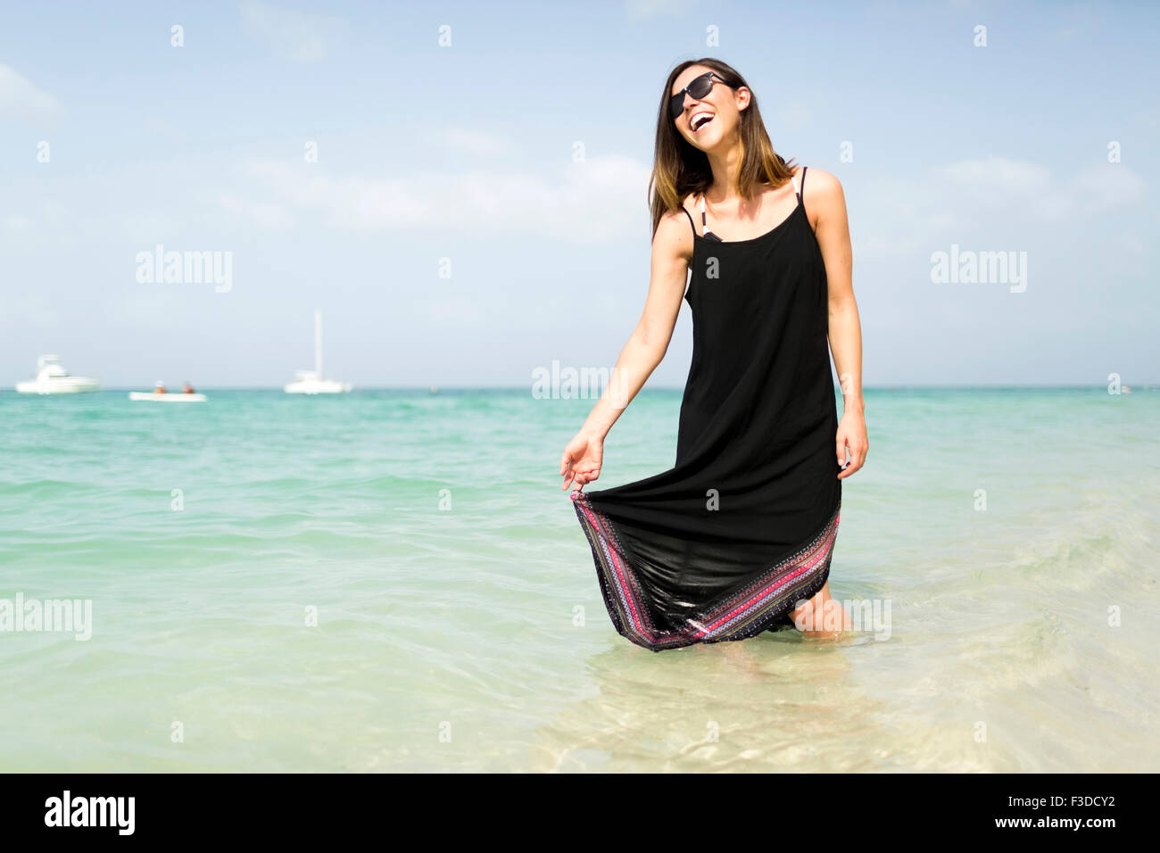 Woman walking on beach Stock Photo