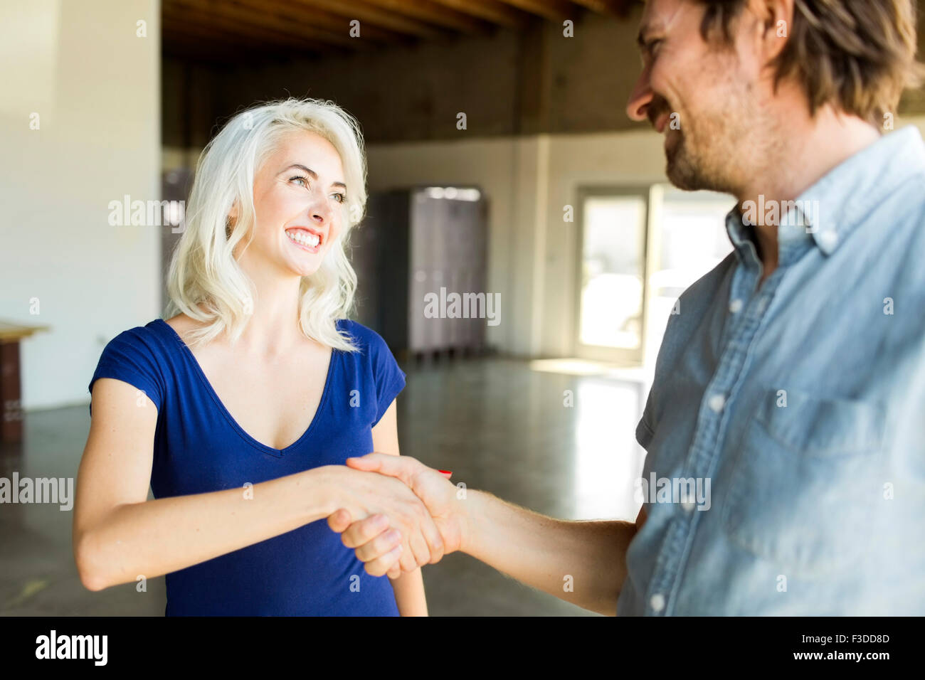 Man greeting with woman Stock Photo - Alamy