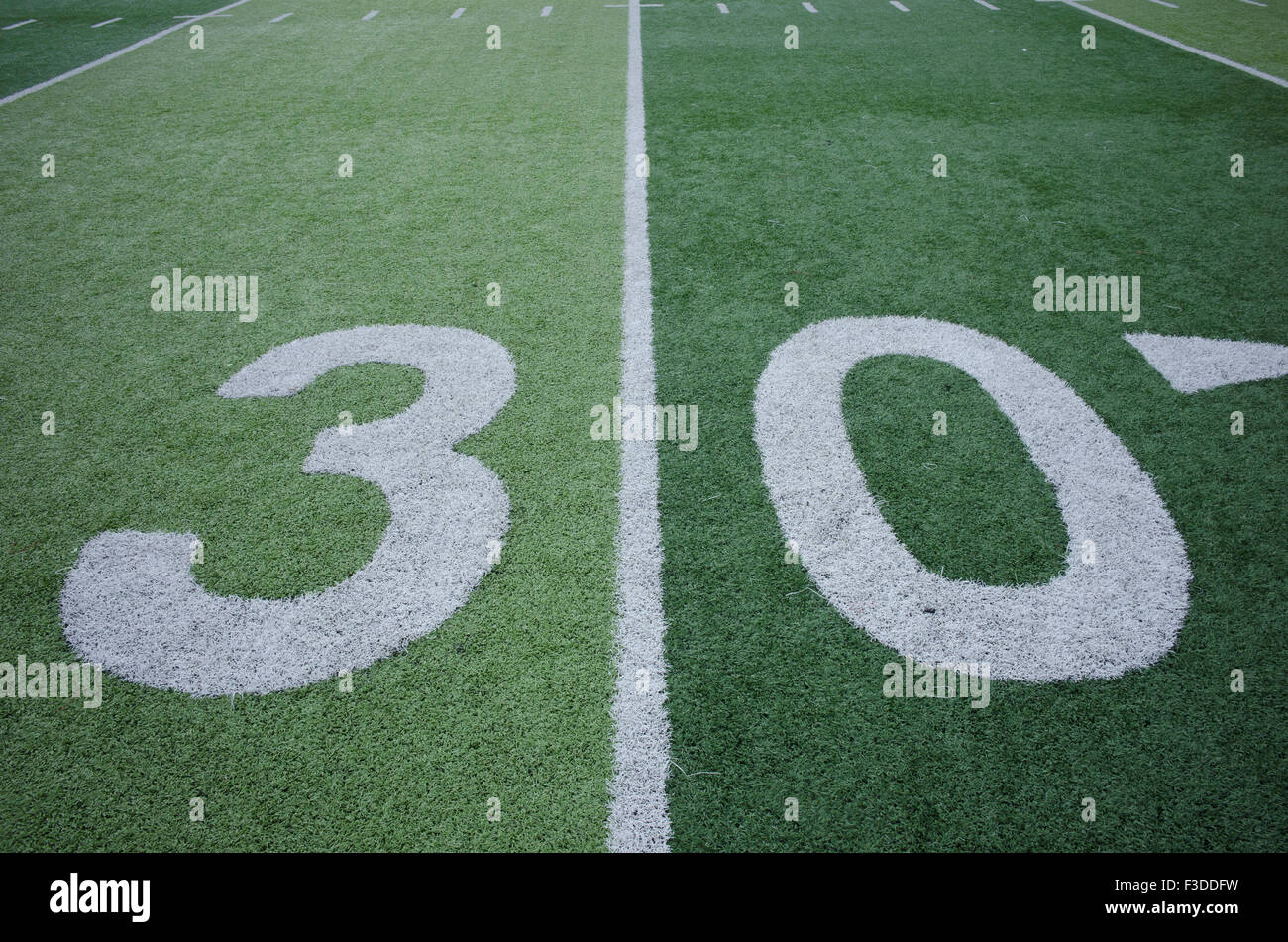 Football field marking of 30 yard line Stock Photo Alamy