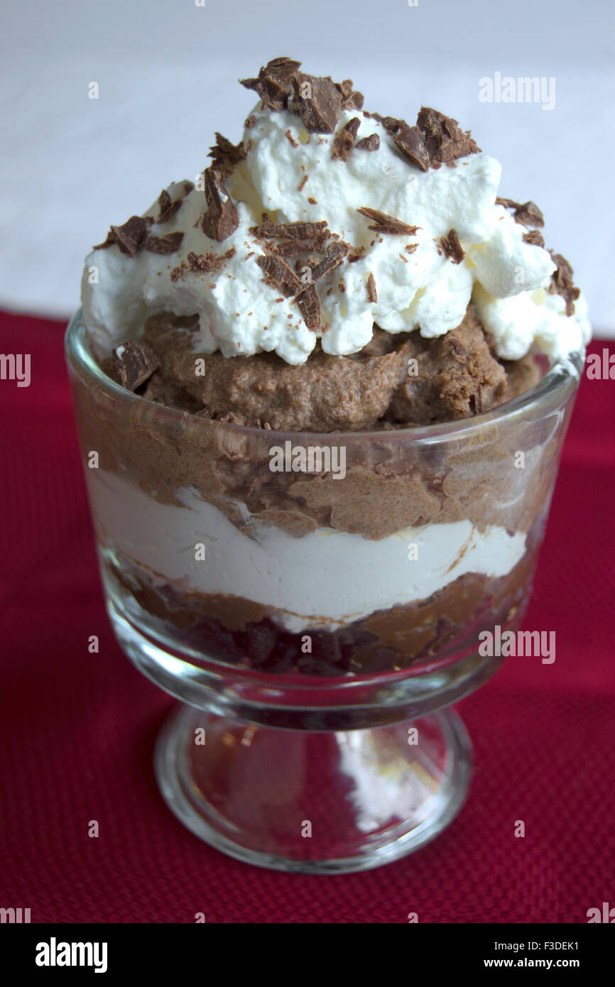 chocolate mousse with whipped cream and chocolate topping Stock Photo