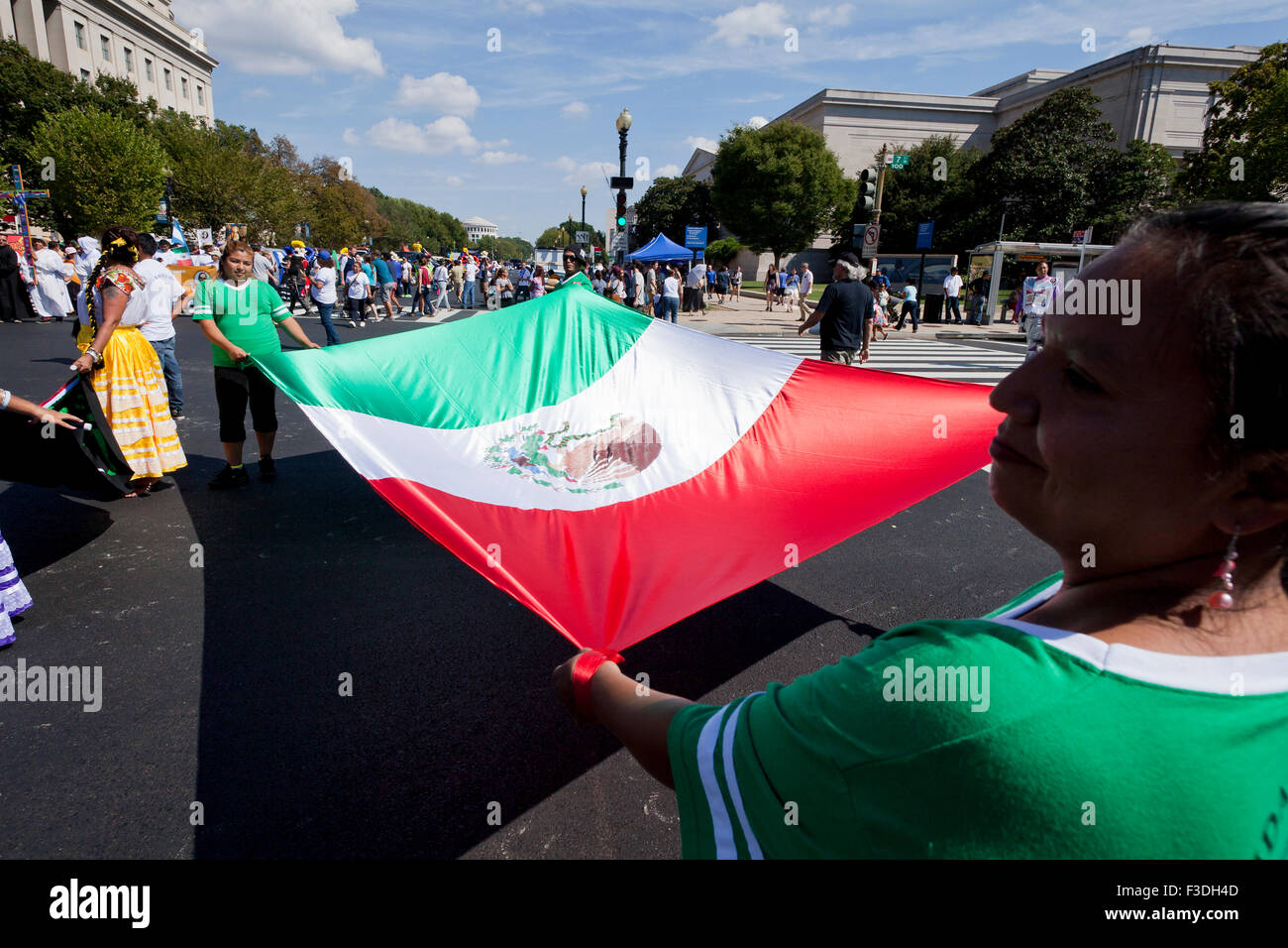 Parade participants holding large Mexican flag at Fiesta DC - Washington, DC USA Stock Photo