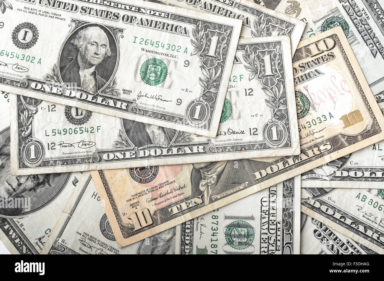 Dollars assorted bills, cash pile background Stock Photo