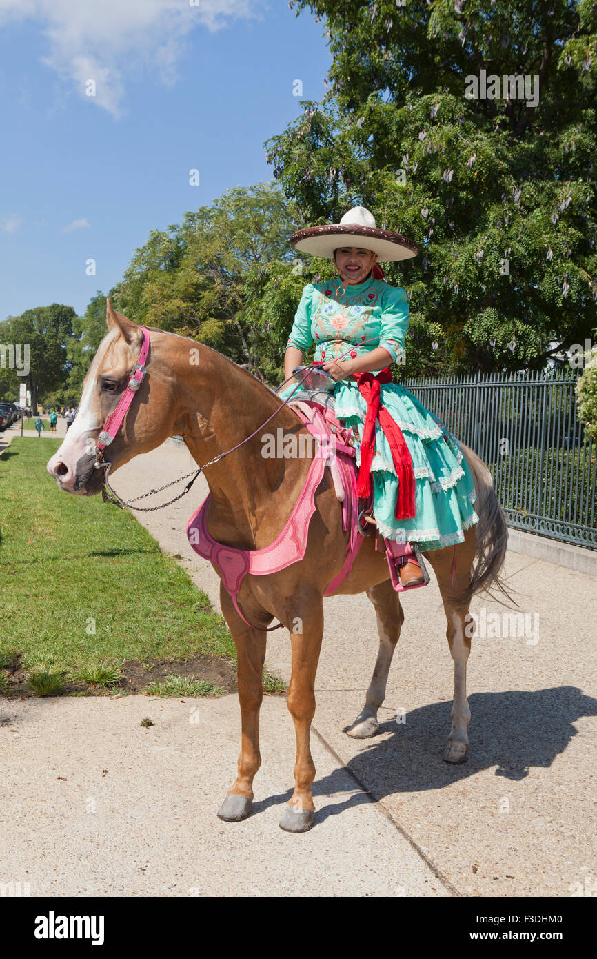 Mexican cowgirls (charras) horseback - USA Stock Photo