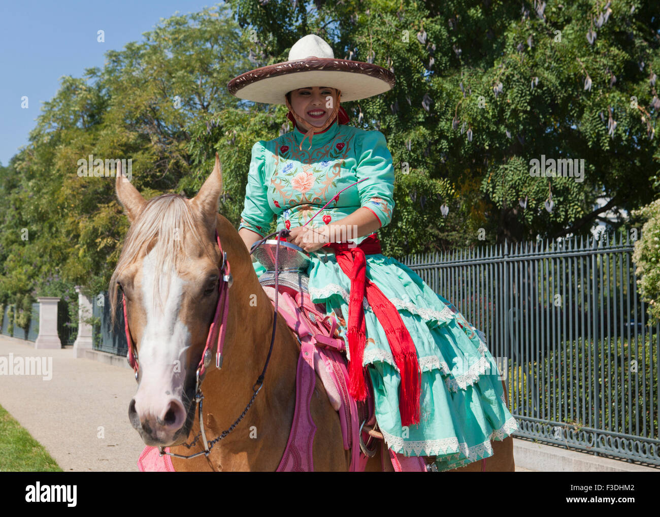 Mexican cowgirls (charras) horseback - USA Stock Photo