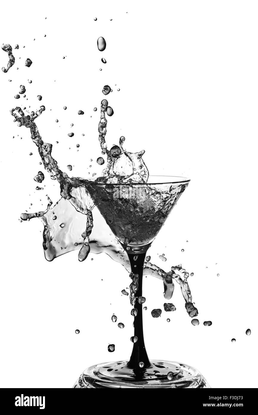 Abstract art. Cocktail glass with splashes of liquid isolated on a