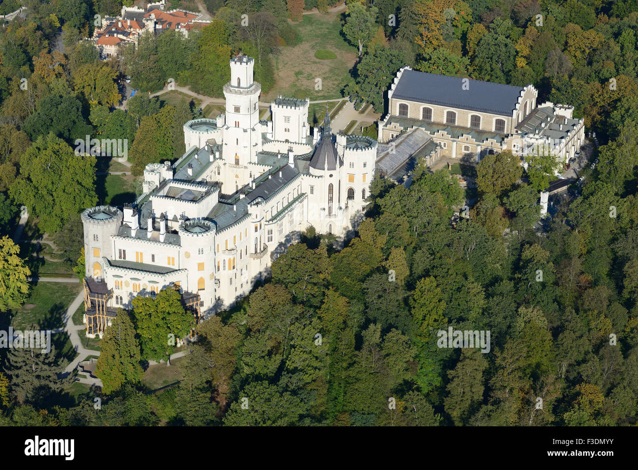 AERIAL VIEW. Hluboká Castle and its surrounding of many trees. Hluboká Nad Vltavou, Bohemia, Czech Republic. Stock Photo