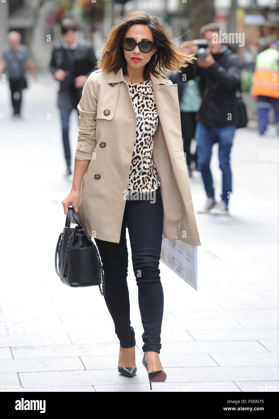 Myleene Klass seen out in London on her way to Smooth Radio holding a  contact sheet of images from a photoshoot. Featuring: Myleene Klass Where:  London, United Kingdom When: 05 Aug 2015