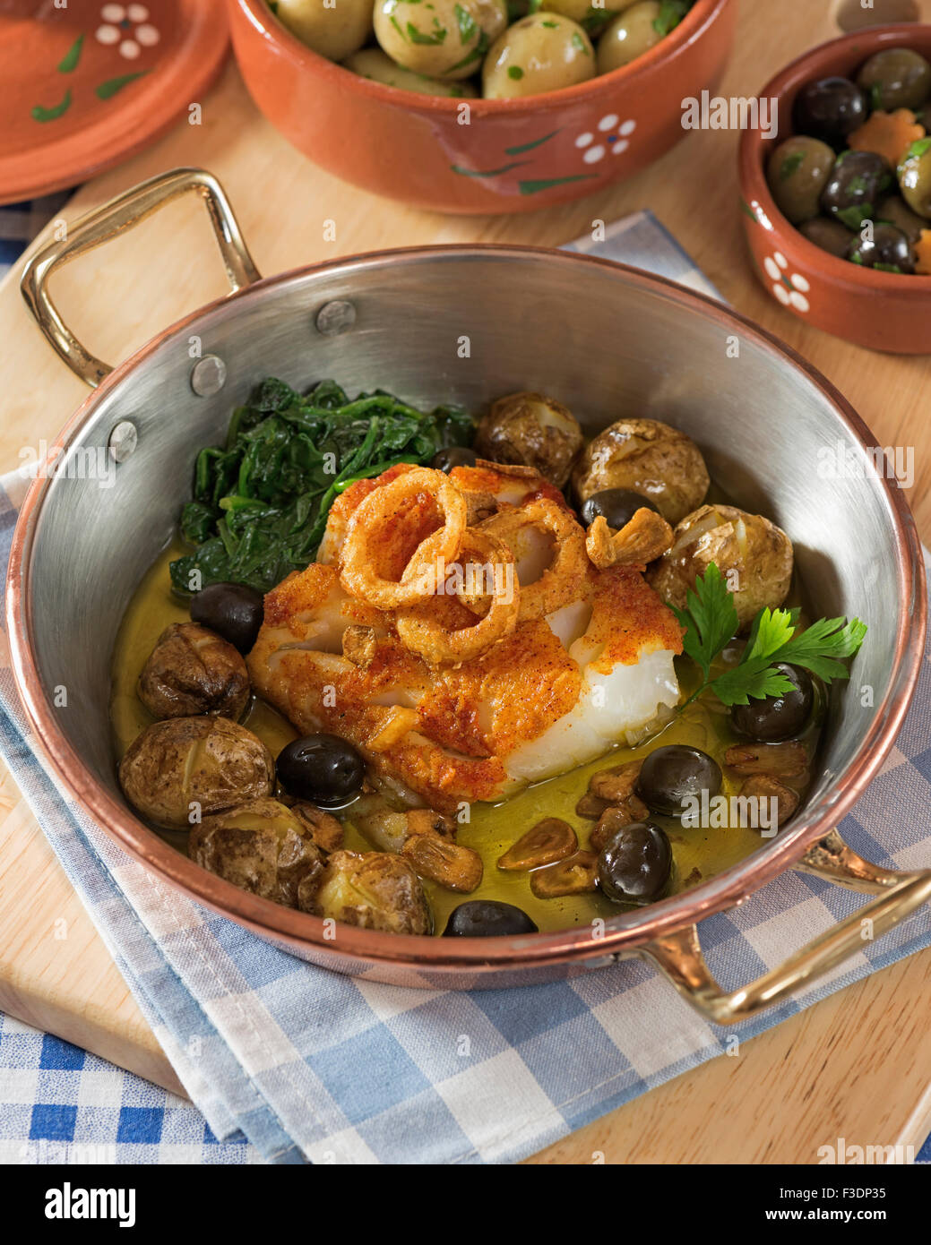 Bacalhau Lagareiro Salt Cod In Olive Oil Portugal Food Stock Photo bacalhau-lagareiro-salt-cod-in-olive-oil-portugal-food-stock-photo