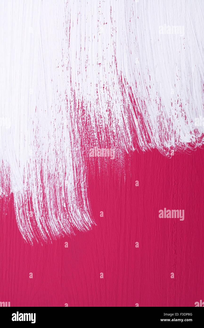 Pink Wooden Board Being Roughly Painted With A Coat Of White Emulsion Stock Photo Alamy