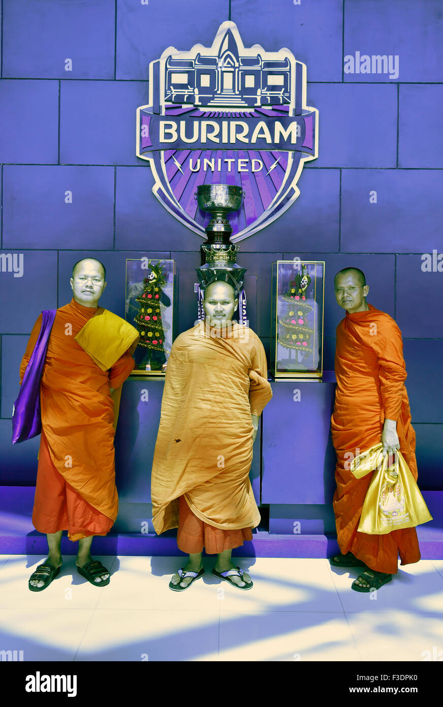 Monks posing in front of the Master Cup of Buriram United, football club, Buriram Province, Thailand Stock Photo