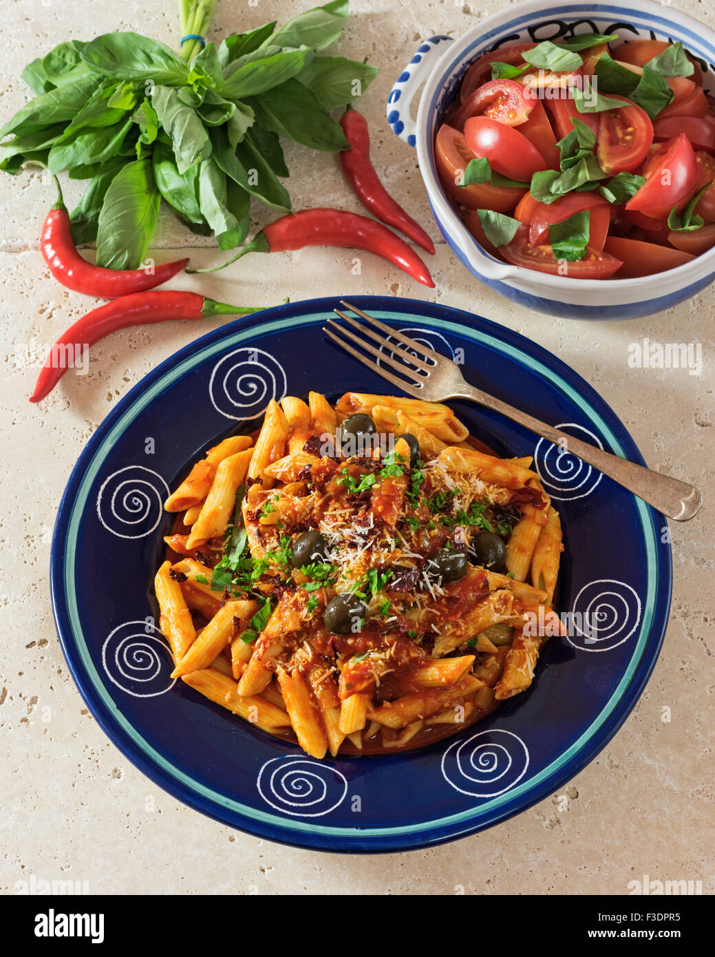 Penne all'Arrabbiata. Pasta in spicy tomato sauce. Italy Food Stock Photo