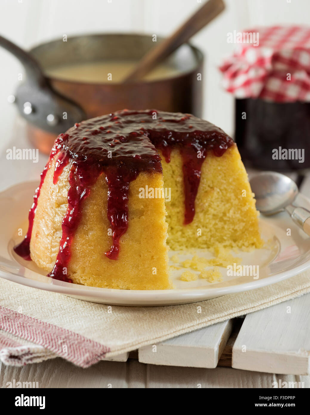 Steamed jam pudding. Traditional dessert UK Stock Photo