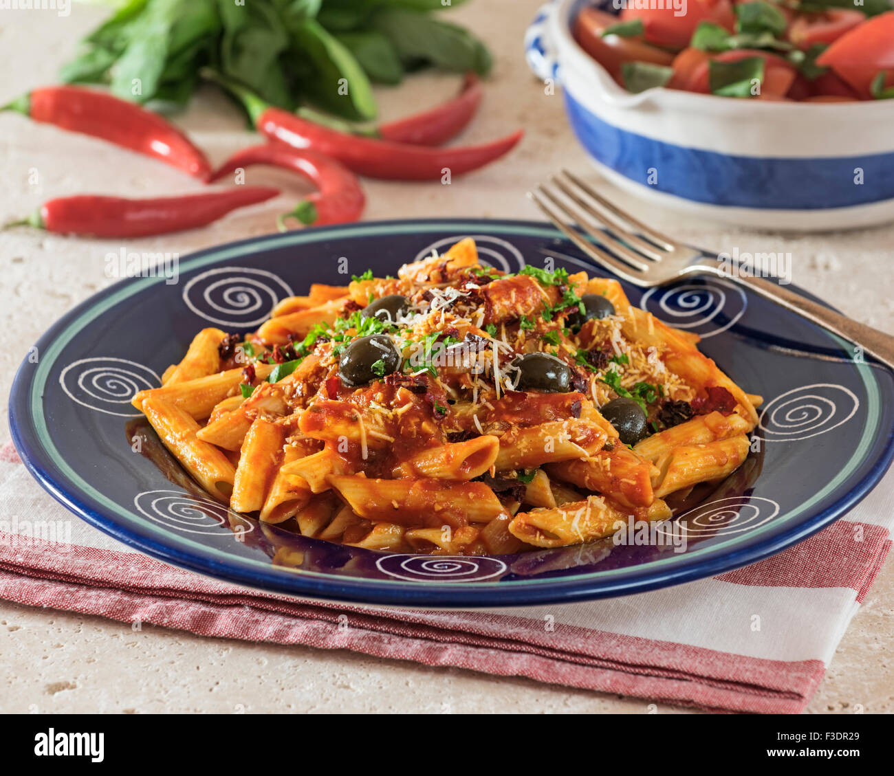 Penne all'Arrabbiata. Pasta in spicy tomato sauce. Italy Food Stock Photo