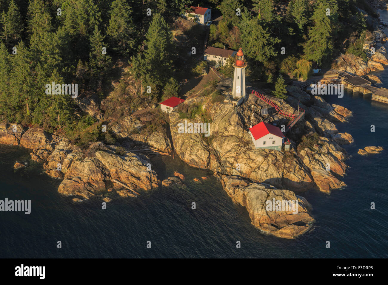 Aerial view from a seaplane on Point Atkinson Lighthouse and the scenic coastline of Vancouver, British Columbia, Canada. Stock Photo