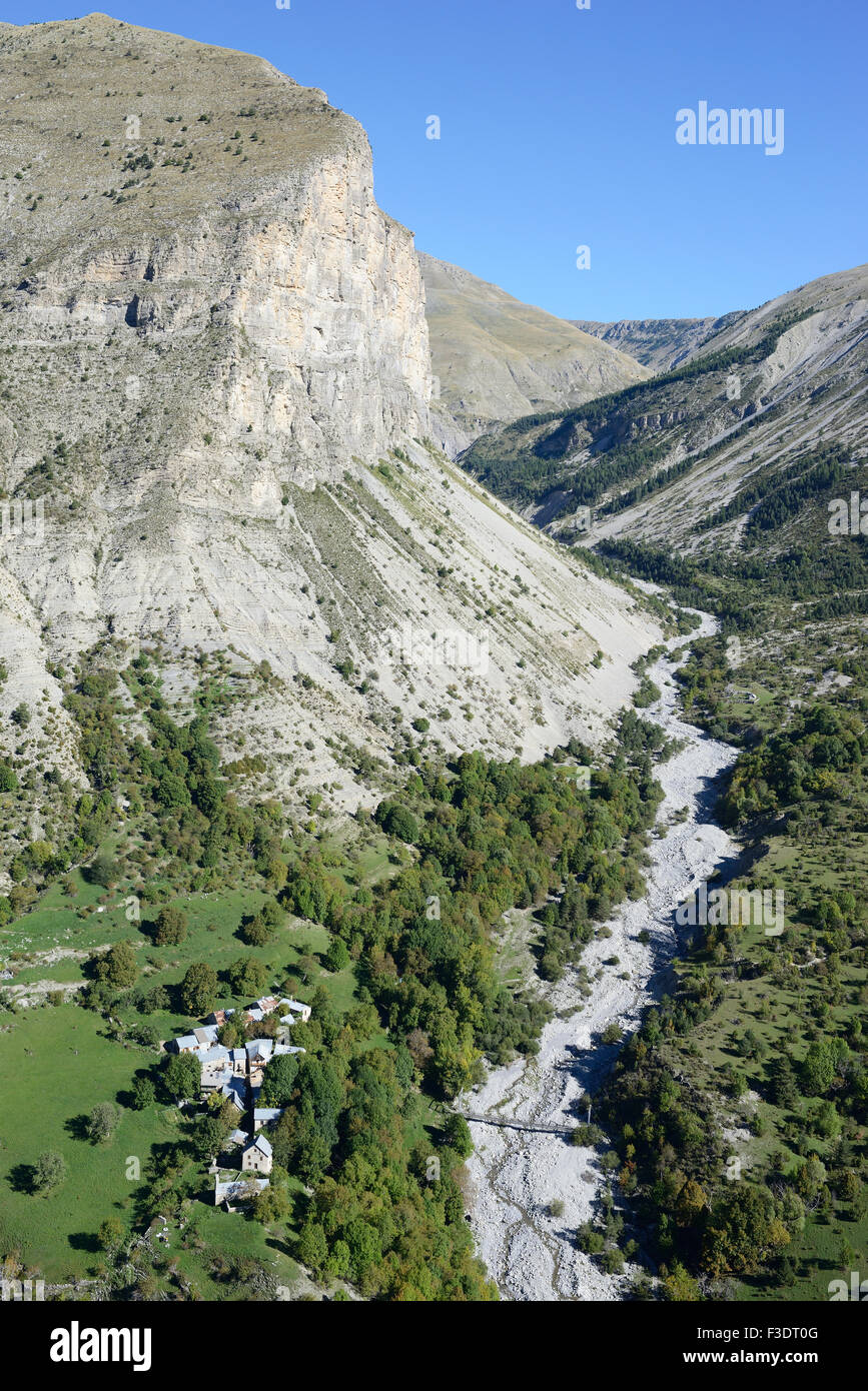 AERIAL VIEW. Remote abandoned hamlet with no access road in a dramatic landscape. Aurent, Alpes de Haute-Provence, France. Stock Photo