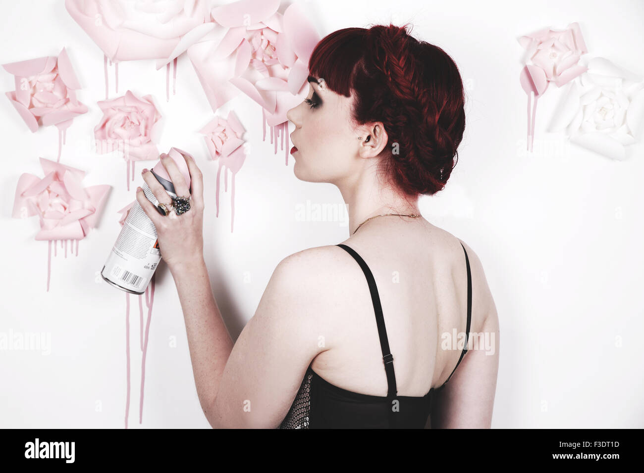 Beautifully romantic red haired girl in a contemporary studio setting Stock Photo