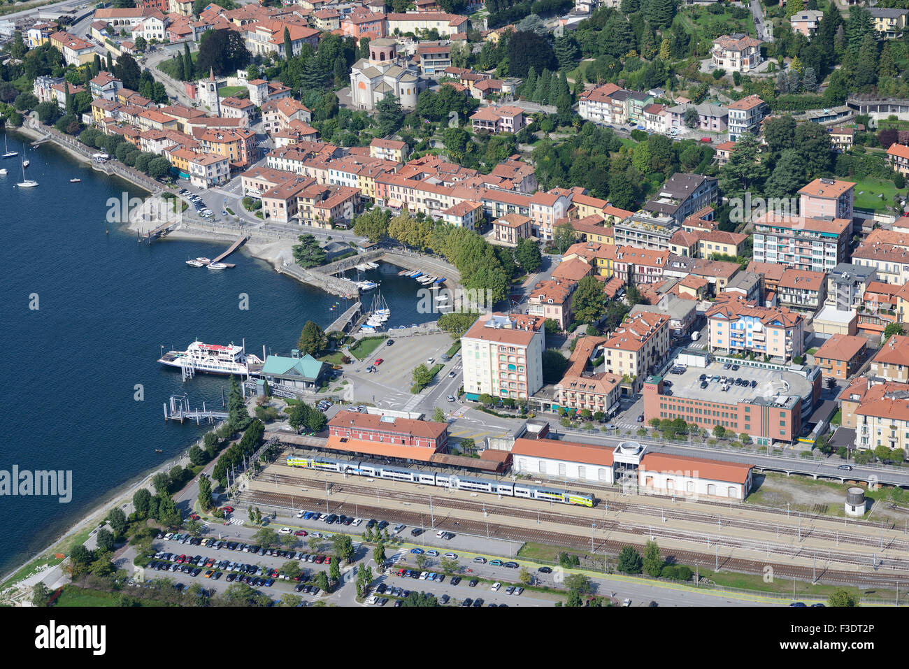 AERIAL VIEW. Train terminal and ferry for the east-west crossing of Lake Maggiore. Laveno, Laveno-Mombello, Province of Varèse, Lombardy, Italy. Stock Photo