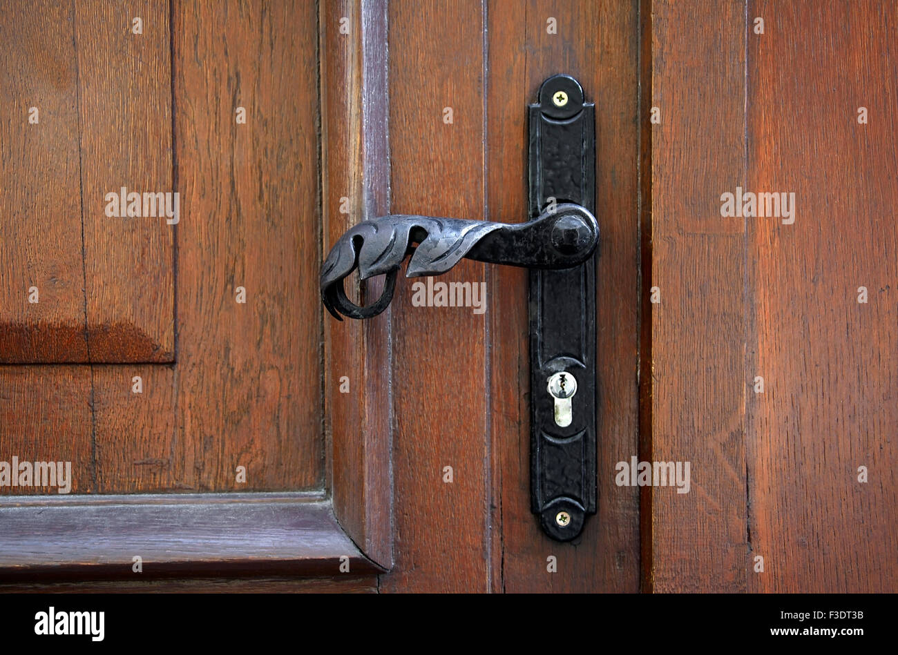 metal door handle on the door brown Stock Photo