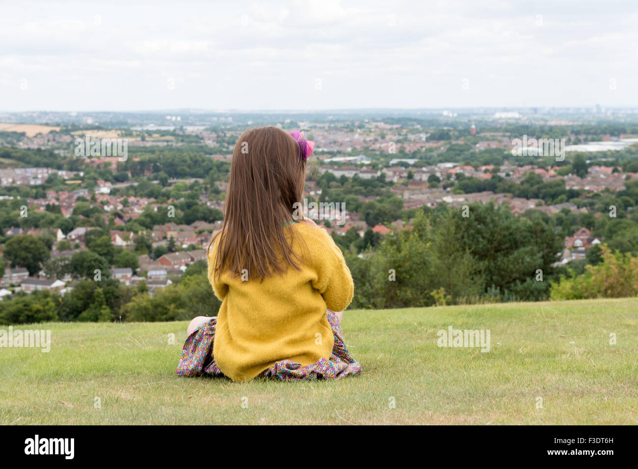 Young girl  Looking at the City from Afar Stock Photo