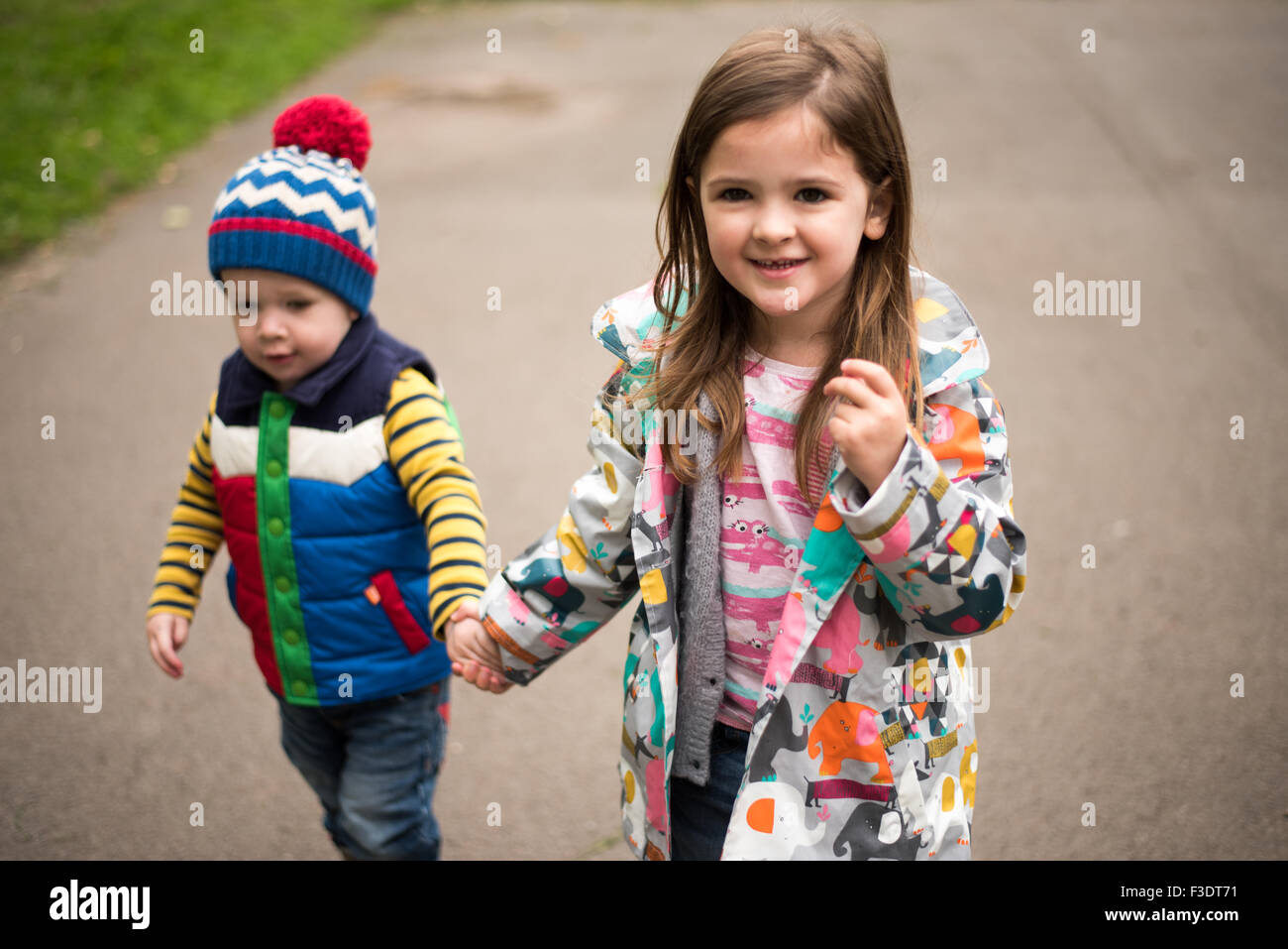 Brother and Sister in park together Stock Photo