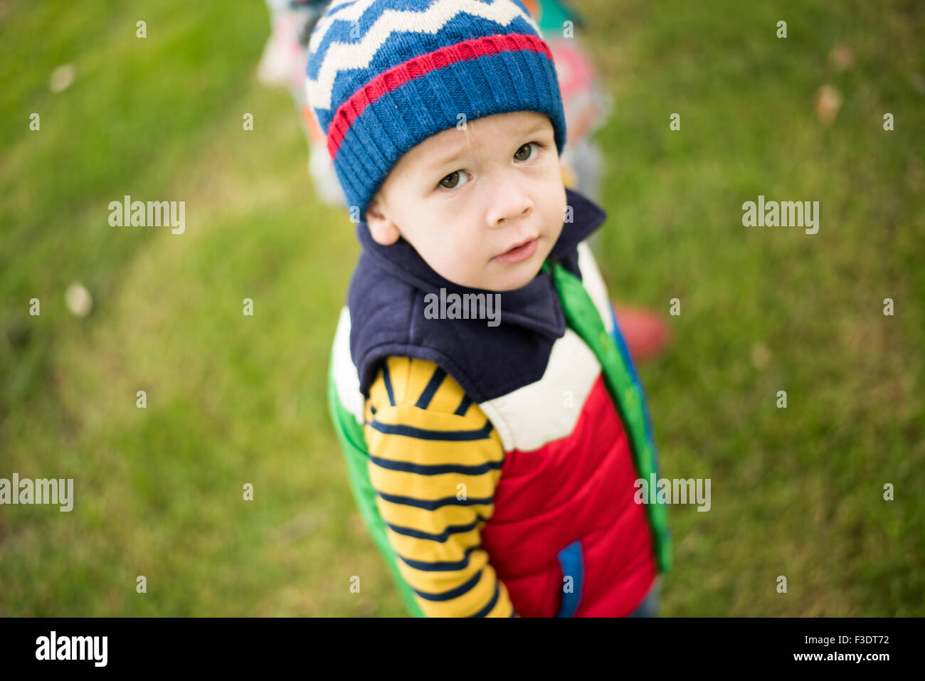 Boy looking at Camera in Park Stock Photo