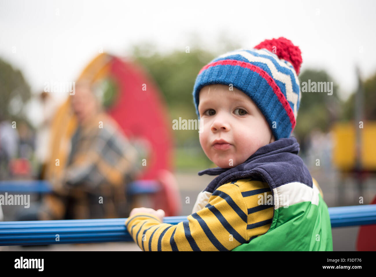 Young Boy playing in park Stock Photo