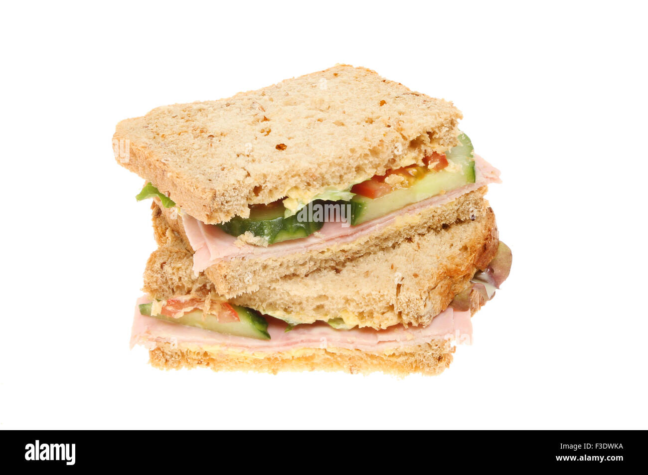 Ham and salad brown bread sandwich isolated against white Stock Photo