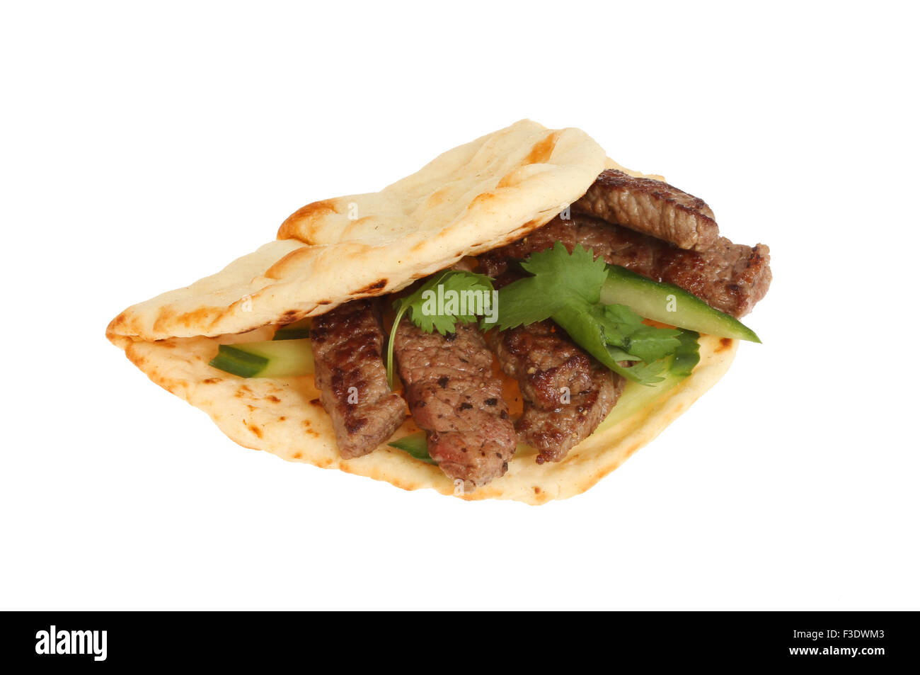 Steak cucumber and coriander in a flatbread isolated against white Stock Photo