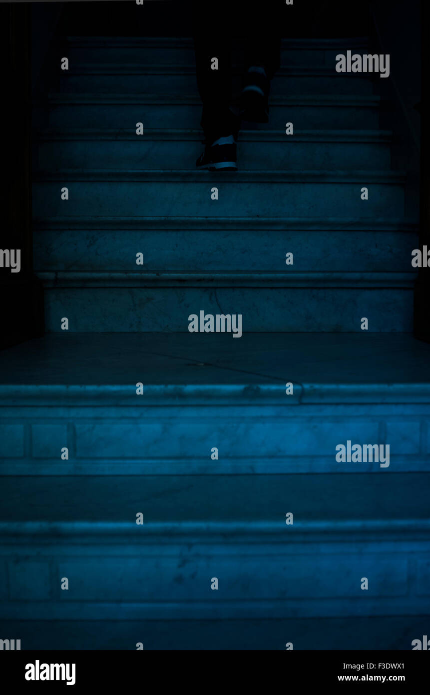 Person going up staircase, low section Stock Photo