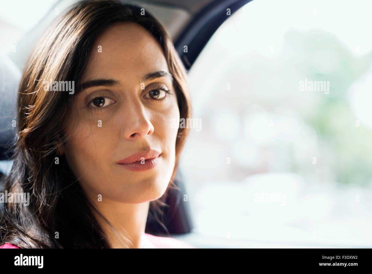 Woman in car, portrait Stock Photo