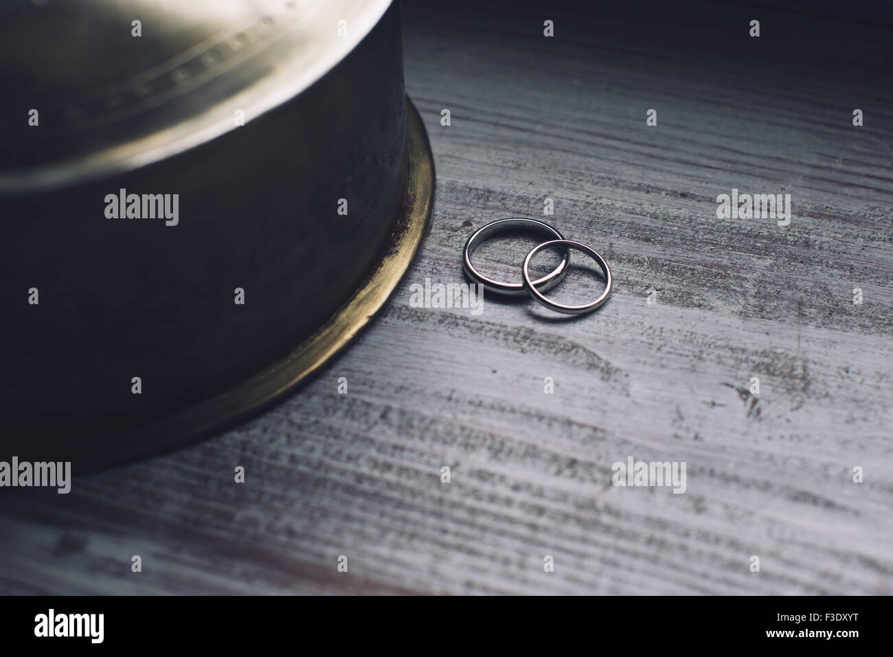 Wedding rings resting on table Stock Photo Alamy