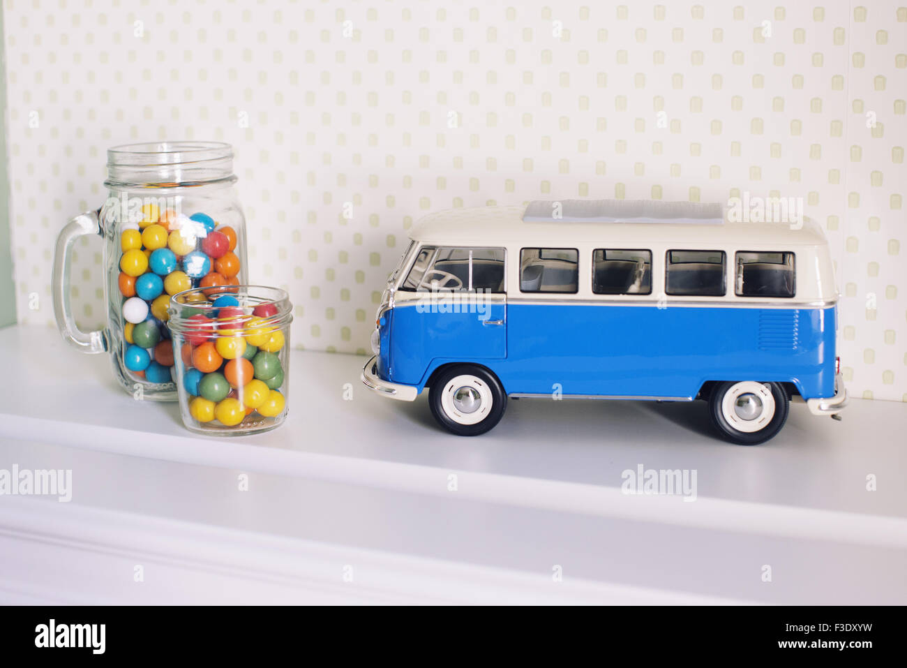 Toy bus and jars of candy Stock Photo