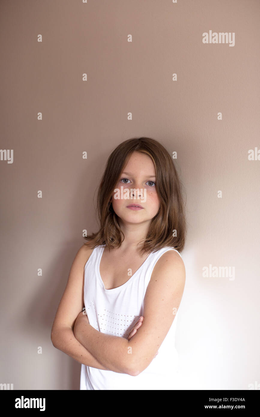 Girl with arms folded across chest, portrait Stock Photo Alamy