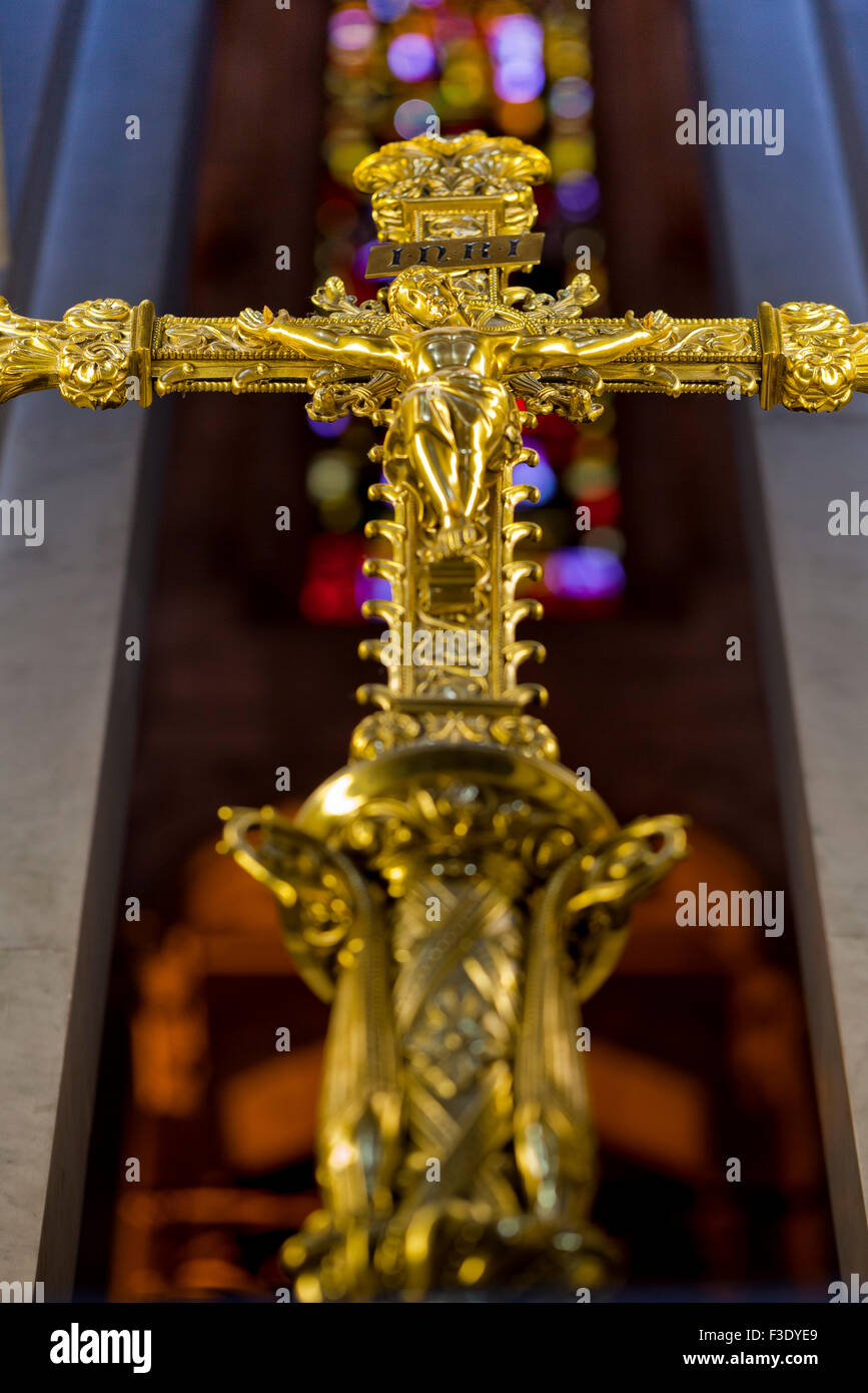 Golden crucifix in church Stock Photo