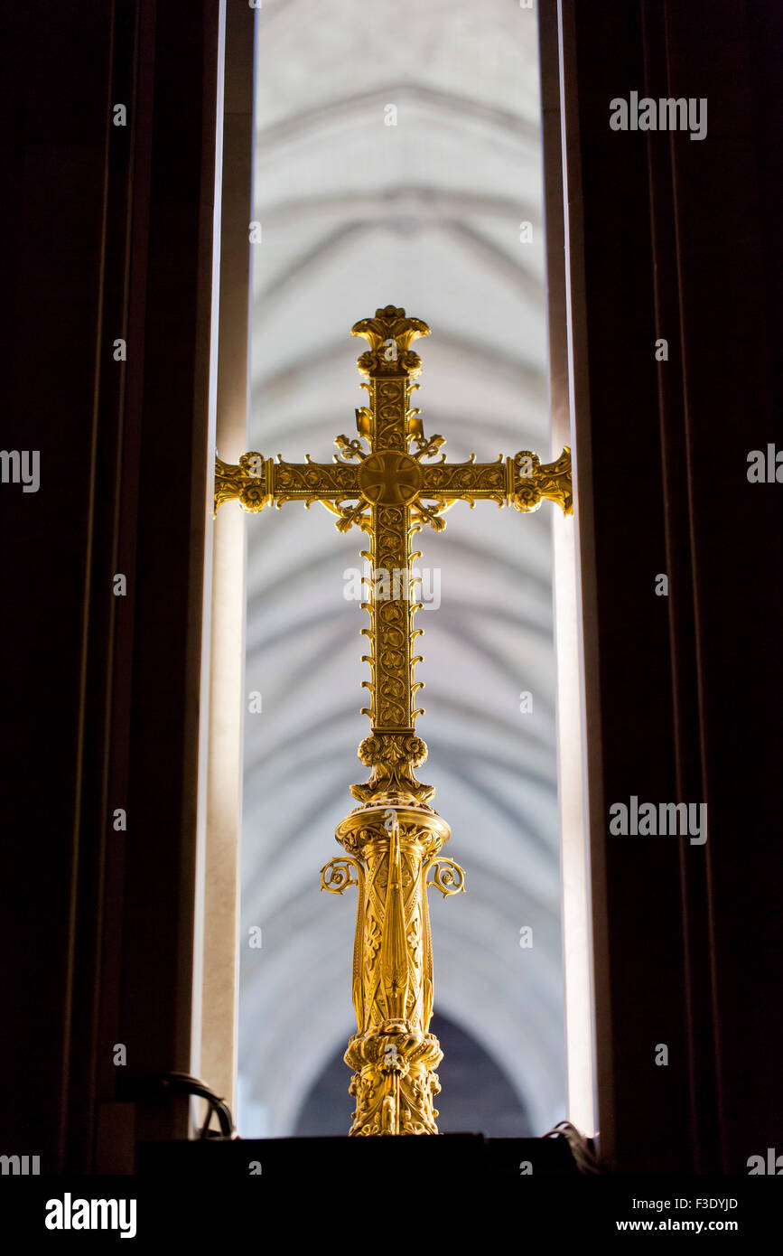 Golden cross inside of church Stock Photo