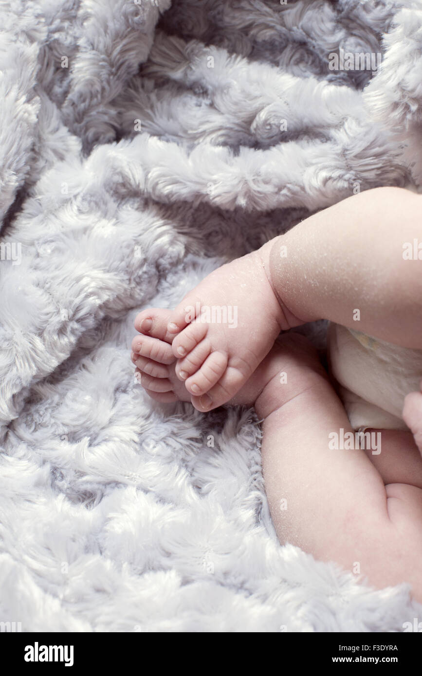 Infant lying on soft blanket Stock Photo