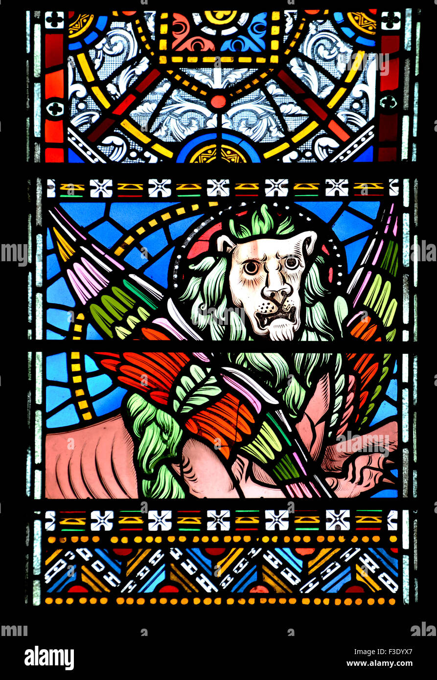 London, England, UK. All Saints Church, Margaret Street. Stained glass window: winged lion of St Mark the Evangelist Stock Photo