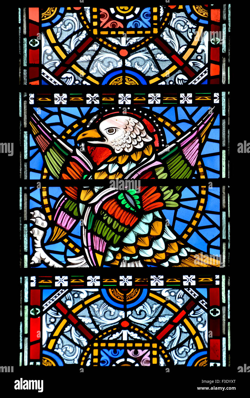 London, England, UK. All Saints Church, Margaret Street. Stained glass window: Eagle of St John the Evangelist Stock Photo