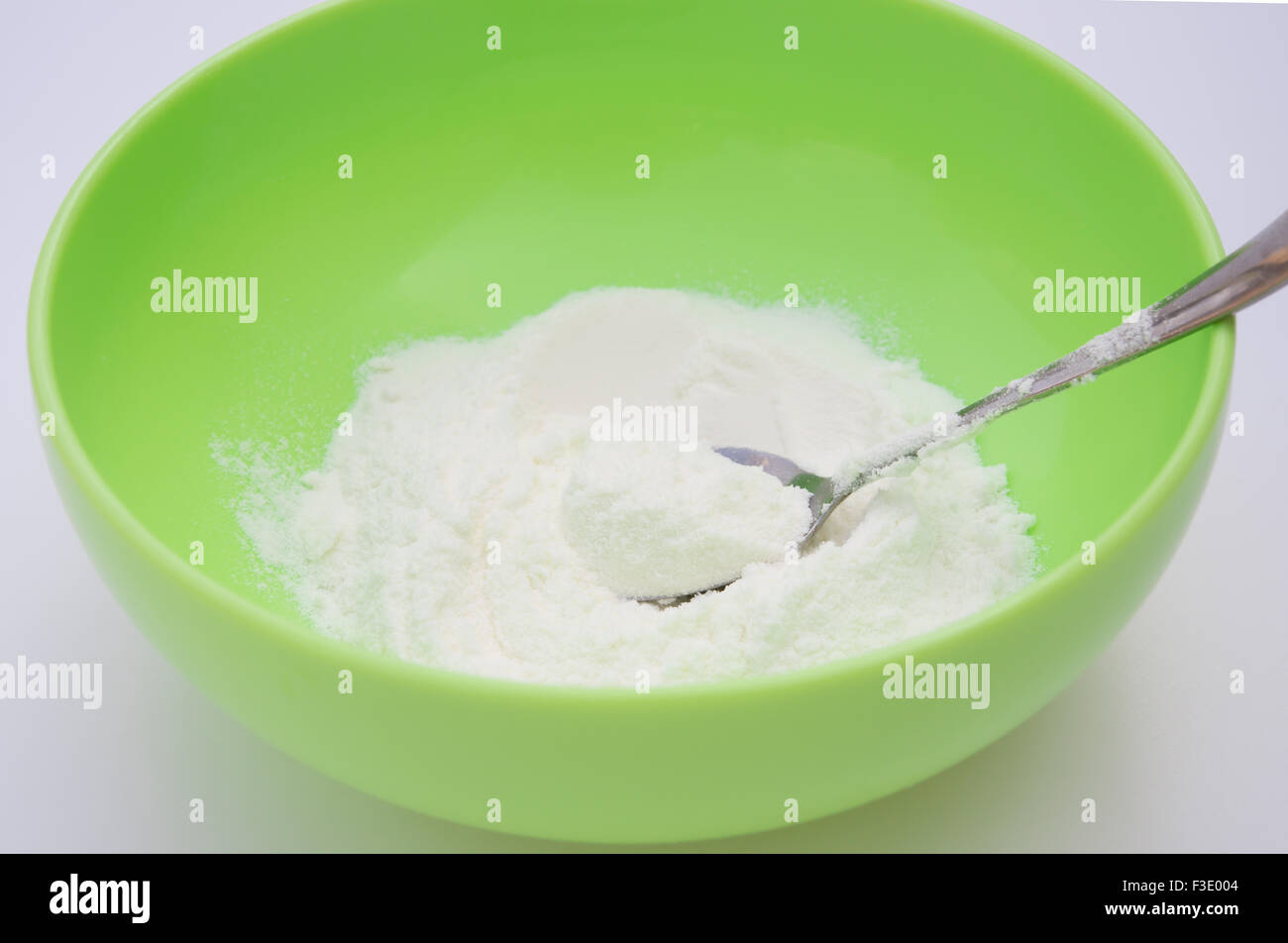 preparing powdered milk in a bowl Stock Photo