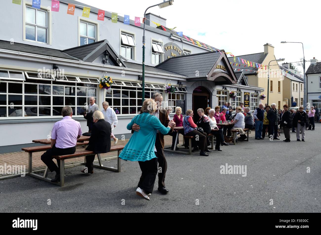 Senior couple dancing in the street during the Matchmaking Festival in Lidoonvarna County Clare Ireland Stock Photo