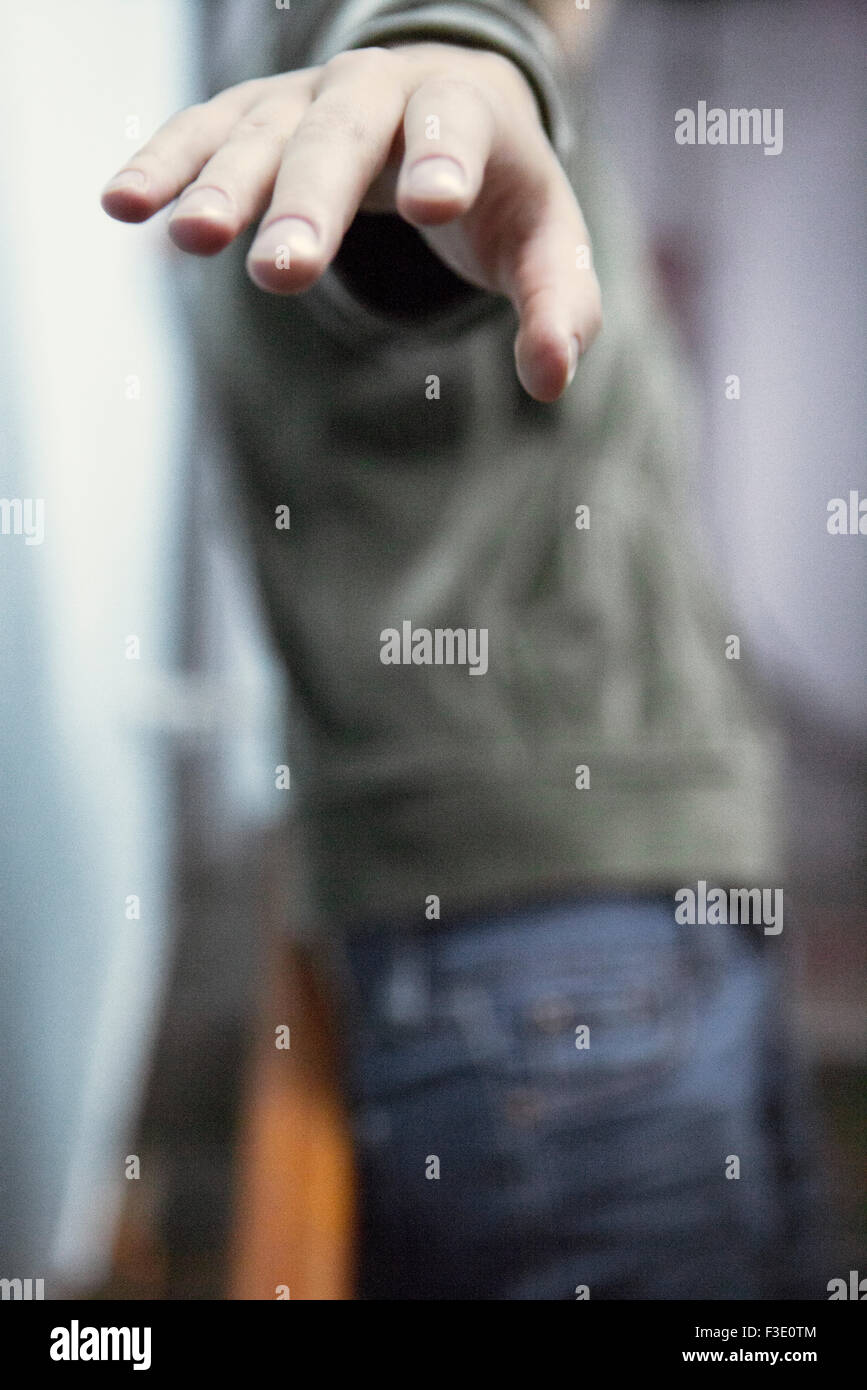 Woman gesturing angrily as she walks away Stock Photo