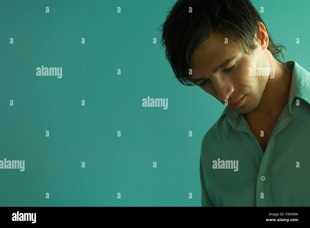 Man with head down, portrait Stock Photo Alamy