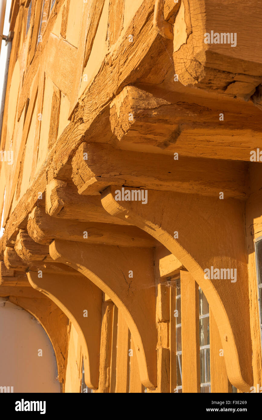 Medieval UK, detail of the jettied front and oak corbels of Little Hall, a medieval half timbered hall house in Lavenham, Suffolk, England, UK Stock Photo