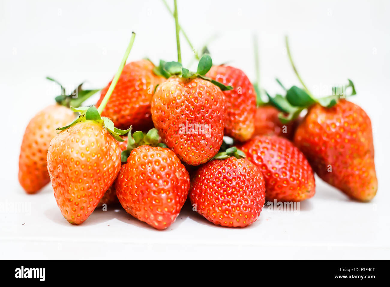 Strawberry berries on a white background Stock Photo - Alamy