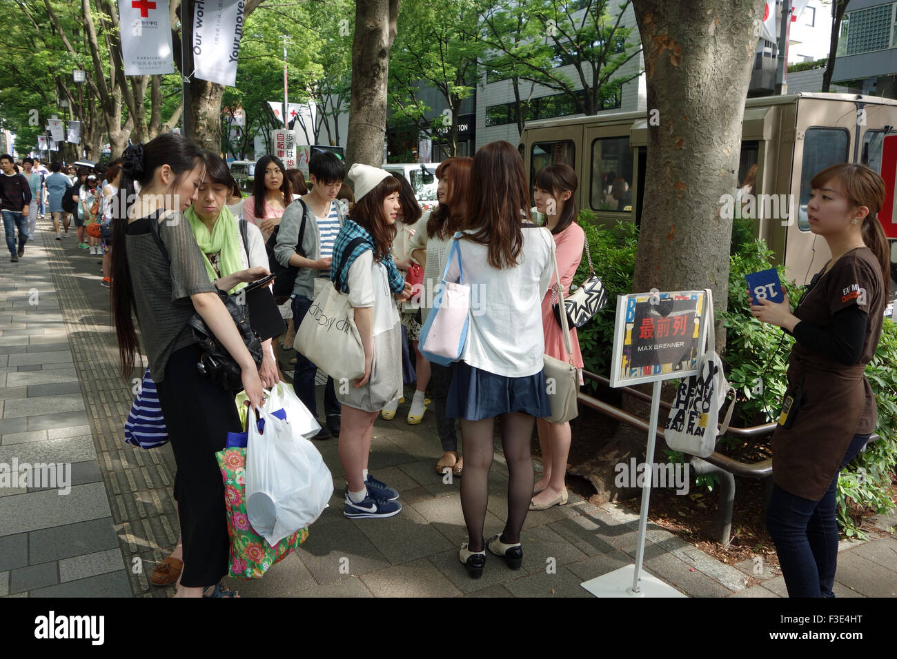 Japanese people queuing for food in in Jingumae, Shibuya Ward, Tokyo. Stock Photo